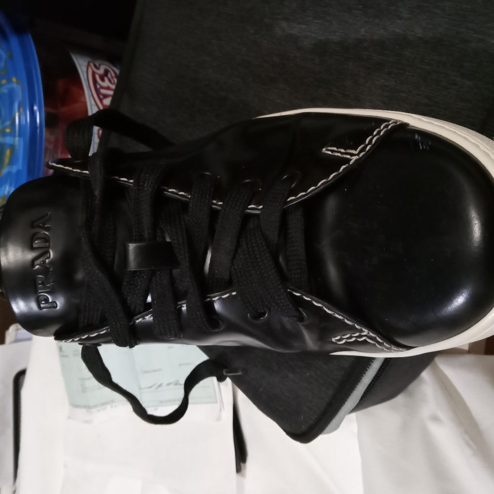 Prada Black Sneakers with Glossy Finish and Metallic Accents